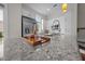 Kitchen island with granite counters, sleek faucet, and modern white cabinets, plus stainless appliances at 256 William Drummond Way, Raleigh, NC 27604