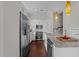 Well-equipped kitchen with stainless steel appliances, a spacious island, and modern fixtures at 256 William Drummond Way, Raleigh, NC 27604