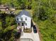 Aerial view of a charming two-story home with well-maintained lawn and mature trees at 2801 Dearborn Dr # A, Durham, NC 27704