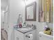 Bright bathroom with granite countertop vanity, modern fixtures, and framed mirror at 2801 Dearborn Dr # A, Durham, NC 27704