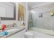 Bathroom featuring a granite countertop vanity and a glass-enclosed shower-tub at 2801 Dearborn Dr # A, Durham, NC 27704