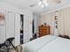 Bedroom featuring bi-fold closet doors, dresser, and comfortable bedding at 2801 Dearborn Dr # A, Durham, NC 27704