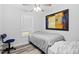 Comfortable bedroom featuring hardwood floors and a window for natural light at 2801 Dearborn Dr # A, Durham, NC 27704