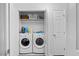 Laundry room with shelving features a washer and dryer, ensuring convenient chores at 2801 Dearborn Dr # A, Durham, NC 27704