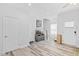 Bright living room with hardwood floors, neutral walls, recessed lighting, and several entryways at 2801 Dearborn Dr # A, Durham, NC 27704