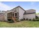 A backyard features a screened porch, green grass and garden area at 2812 Lemnos Dr, Apex, NC 27502