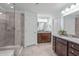 Elegant bathroom with granite countertops, walk-in shower, and dual vanity at 2812 Lemnos Dr, Apex, NC 27502