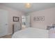 Light-filled bedroom with doorway to another room and featuring soft pink tones and stylish decor at 2812 Lemnos Dr, Apex, NC 27502