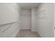 Empty walk-in closet with built-in shelving, ready for organization at 2812 Lemnos Dr, Apex, NC 27502