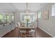 The dining area is open to the living room, offering wood floors, neutral walls, and views to the outside at 2812 Lemnos Dr, Apex, NC 27502