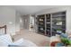 Upstairs hallway with built-in bookcases and inviting seating area at 2812 Lemnos Dr, Apex, NC 27502