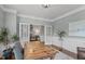Home office featuring French doors, a decorative rug and chair, and view of the staircase at 2812 Lemnos Dr, Apex, NC 27502