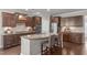 Kitchen featuring granite countertops, stainless steel appliances, and dark wood cabinets at 2812 Lemnos Dr, Apex, NC 27502