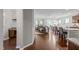 Open concept living space with wood floors and a seamless transition to dining area and kitchen at 2812 Lemnos Dr, Apex, NC 27502