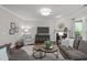 Living room has hardwood floors, a fireplace with mantle, neutral walls, modern furnishings and nice décor at 2812 Lemnos Dr, Apex, NC 27502