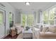 Sunroom features large windows, neutral walls and carpet, and a lot of natural light at 2812 Lemnos Dr, Apex, NC 27502