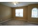 Bright bedroom with carpet flooring and large windows at 2945 Casona Way, Raleigh, NC 27616