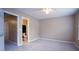 Large bedroom with ceiling fan and adjoining bathroom at 2945 Casona Way, Raleigh, NC 27616