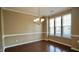 Inviting dining area with chandelier lighting and large windows at 2945 Casona Way, Raleigh, NC 27616