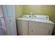 This laundry room contains a washer and dryer for convenient laundry at 2945 Casona Way, Raleigh, NC 27616