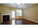 Cozy living room with fireplace and access to the outdoors at 2945 Casona Way, Raleigh, NC 27616