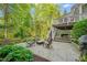 Backyard features an outdoor patio with seating, green foliage, and a view of the deck at 314 Hogan Woods Cir, Chapel Hill, NC 27516