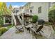Outdoor patio boasts stylish seating, a grill, and a view of the upper deck at 314 Hogan Woods Cir, Chapel Hill, NC 27516