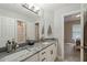 Bright bathroom with double sinks, granite countertop, and modern fixtures at 314 Hogan Woods Cir, Chapel Hill, NC 27516