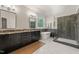 Bright bathroom featuring a freestanding tub, walk-in shower with subway tile, and double sink vanity at 314 Hogan Woods Cir, Chapel Hill, NC 27516