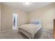 Bright bedroom, features a comfy bed, soft carpet, and a view into the ensuite at 314 Hogan Woods Cir, Chapel Hill, NC 27516