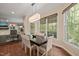 Charming breakfast nook featuring a modern light fixture, large windows, and access to the outdoor area at 314 Hogan Woods Cir, Chapel Hill, NC 27516