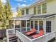 An elevated wooden deck showcasing a screened-in porch and outdoor lounge chairs at 314 Hogan Woods Cir, Chapel Hill, NC 27516