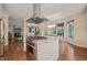 Bright kitchen features stainless steel appliances, marble countertops, a spacious island, and hardwood floors at 314 Hogan Woods Cir, Chapel Hill, NC 27516