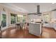 Spacious kitchen with an island, stainless steel appliances, and a dining area with large windows at 314 Hogan Woods Cir, Chapel Hill, NC 27516