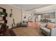 Spacious living room with hardwood floors, neutral walls, stylish seating, and open staircase access at 314 Hogan Woods Cir, Chapel Hill, NC 27516