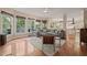 Inviting living room boasts a large sectional, hardwood floors, and an abundance of natural light at 314 Hogan Woods Cir, Chapel Hill, NC 27516