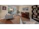Bright living room featuring neutral walls, hardwood floors, a large window, and modern furnishings at 314 Hogan Woods Cir, Chapel Hill, NC 27516