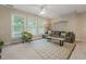 Inviting living room with large windows, neutral color scheme, and comfortable seating area at 314 Hogan Woods Cir, Chapel Hill, NC 27516