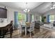 Cozy dining area featuring hardwood floors, natural light, and an open flow to the living room at 318 Natchez Trace, Fuquay Varina, NC 27526