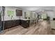 Open kitchen with stainless appliances, seamlessly connected to the dining and living areas at 318 Natchez Trace, Fuquay Varina, NC 27526