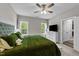 Serene bedroom with large windows, neutral tones, and comfortable furnishings for a restful retreat at 318 Natchez Trace, Fuquay Varina, NC 27526