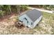 Aerial view of home featuring an elevated deck with patio furniture, light siding and a dark roof at 318 Natchez Trace, Fuquay Varina, NC 27526