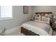 Cozy bedroom boasts natural light, soft carpet, and patterned headboard at 3416 Edgemont Dr, Raleigh, NC 27612