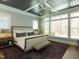 Cozy bedroom showcasing a trey ceiling, fan, and large window at 3416 Edgemont Dr, Raleigh, NC 27612