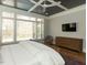Bedroom showcasing a trey ceiling, fan, large window and dresser at 3416 Edgemont Dr, Raleigh, NC 27612