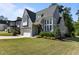 Stunning exterior of a two-story home with large windows, manicured lawn, and charming curb appeal at 3416 Edgemont Dr, Raleigh, NC 27612