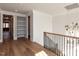Upstairs hallway features hardwood floors, shiplap walls, and built-in shelving at 3416 Edgemont Dr, Raleigh, NC 27612