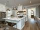 Bright kitchen features a large island with white countertop and stainless steel appliances at 3416 Edgemont Dr, Raleigh, NC 27612