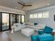 Comfortable living room featuring recessed lighting, fan, and sliding glass doors to patio at 3416 Edgemont Dr, Raleigh, NC 27612