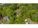 An aerial view of a quaint home nestled within lush, mature trees at 3428 Hardwood Dr, Apex, NC 27539